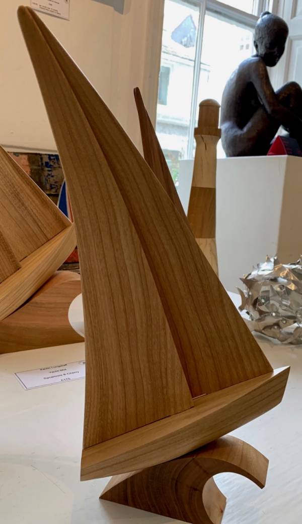 - a , wood Sculpture by Kevin Longstaff, measuring 34 x 17 cm (H x W) £95